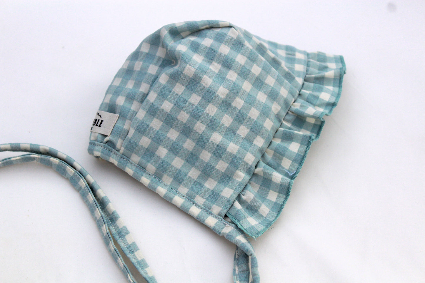 Capota infantil de algodón vichy azul con volante- Colección Orígenes